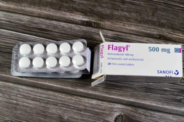 Cairo, Egypt, November 27 2024: Flagyl metronidazole 500mg tablets, Amebicides, an antibiotic that is used to treat bacterial infections of the vagina, stomach, liver, skin, joints, brain, spinal cord