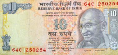 Hindistan Rezerv Bankası tarafından yayınlanan 10 Hint Rupisi 'nin ters tarafının büyük bir kısmında Mahatma Gandhi' nin bir portresi, sağ altta Rezerv Bankası mührü, Hindistan para birimi