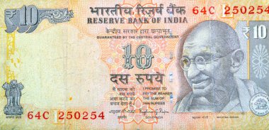Hindistan Rezerv Bankası tarafından yayınlanan 10 Hint Rupisi 'nin ters tarafının büyük bir kısmında Mahatma Gandhi' nin bir portresi, sağ altta Rezerv Bankası mührü, Hindistan para birimi