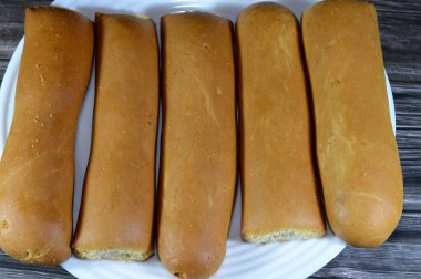 Breadsticks, also known as grissini, grissino or dipping sticks, pencil-sized sticks of crisp, dry baked bread, There is also a soft-baked breadstick version, rusk, bread crunch crackers