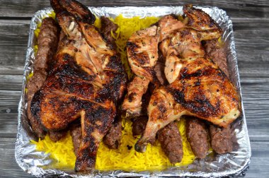 Arabic cuisine traditional food beef  Kofta, kofta shish which is minced meat with Basmati rice , oriental grilled barbecued meat food with long yellow rice and charcoal grilled barbecued chicken clipart