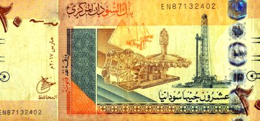Sudan merkez bankasının 20 SDG 20 Sudan pound nakit para banknotunun ters tarafının büyük bir kısmında Antik petrol çıkarma makineleri, petrol çıkarma makineleri, Sudan Nubian piramitleri yer alıyor.