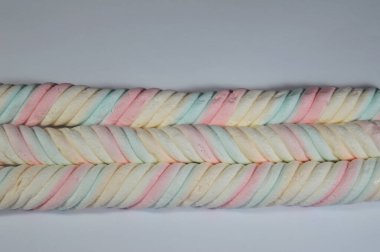 Marshmallows, marshmallow is a confectionery made from sugar, water and gelatin whipped to a solid-but-soft consistency, its naming comes from mallow plant species (Althaea officinalis), pile of candy