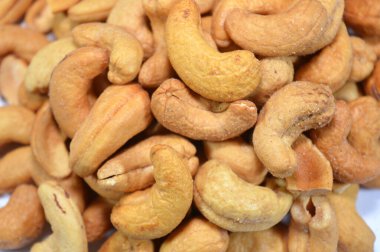 Salted and roasted Cashew nuts, Cashew is the common name of a tropical evergreen tree Anacardium occidentale, in the family Anacardiaceae. It is native to South America, the source of the cashew nut