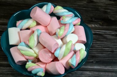 Marshmallows, marshmallow is a confectionery made from sugar, water and gelatin whipped to a solid-but-soft consistency, its naming comes from mallow plant species (Althaea officinalis), pile of candy