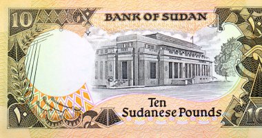 10 SDG 'nin ters tarafının büyük bir kısmı 10 Sudan sterlini nakit para banknotu, Sudan Bankası' nın Hartum 'daki genel merkezi, Sudan' ın eski parası