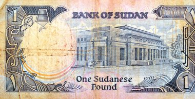 1 SDG 'nin ters tarafının büyük bir kısmı Sudan nakit para banknotu, Hartum' daki Sudan Merkez Bankası binası, Sudan 'ın eski antika parası, seçici odak noktası