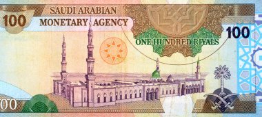 100 SAR 100 Suudi Arabistan riyalistinin büyük bir kısmı nakit para banknotu, Madina 'daki Kutsal Peygamber Camii' nin genel bir görüntüsü, eski model Suudi parası