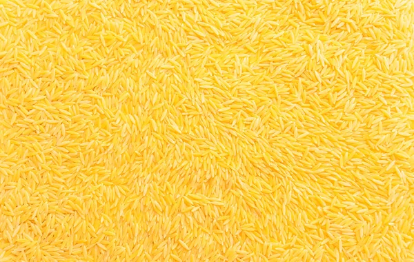 乾燥リゾーニの背景食感 オルゾパスタ イタリア料理 リゾットやサラダにデュラム小麦セモリナパスタ お米の形のオルゾパスタ 水平面 トップビュー フラットレイアウト — ストック写真