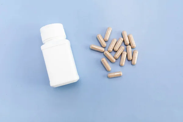 Top View Scattered Pills Capsules Slippery Elm White Bottle Container — Stock Photo, Image