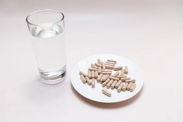 Top View Handful Pills Capsules Slippery Elm Glass Water Table — Stock Photo, Image