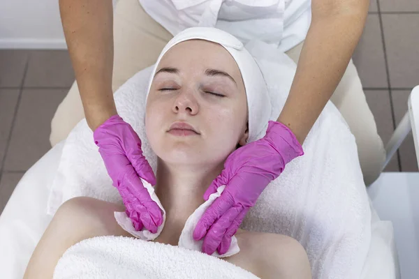 Top View Cosmetologist Clears Skin Of Neck And Face Of Young Woman Before Beauty Procedure, Rejuvenation In Spa Center. Patient Getting Needle Mesotherapy, Flatly Skincare. Horizontal Plane.