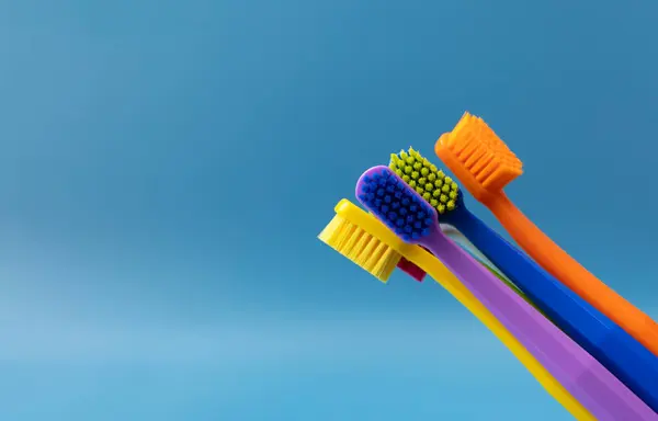 Design Bunch Colorful Toothbrushes Blue Background Oral Hygiene Dental Care — Stock Photo, Image