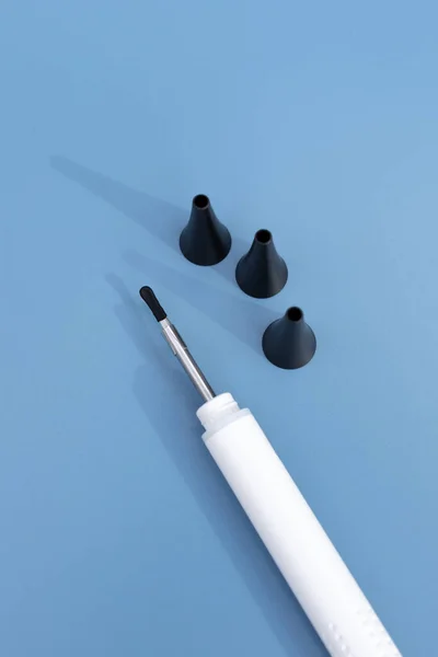 Top View Ear Scope For Wax Removal Tool with Nozzles Set. Digital Otoscope, Earwax Cleaner With Gyroscope, Camera, Light. Cleaning Ears Device Connected to Smartphone. Ear Cleaning Technology. Mockup.