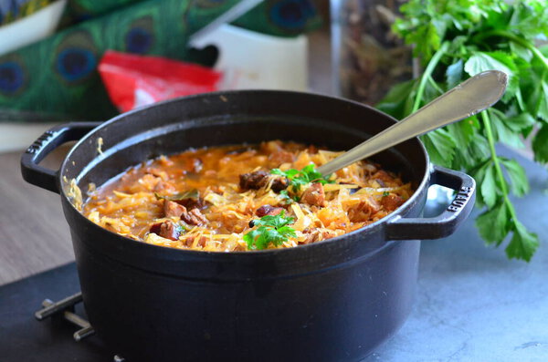  traditional Czech, Polish and Lithuanian Food, served in a black plate, tasty autumn meal with meat and cabbage,