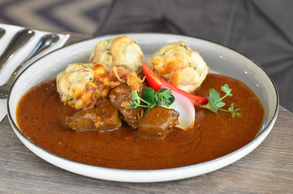 stew beef goulash, serving on plate