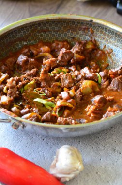 delicious pasta with tomato sauce, beef prklt with sour peppers and mushrooms, top view clipart