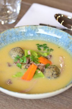 close view of traditional Czech food, Kaldoun goose soup, served food on a plate in a restaurant, wooden table, Saint Martin's goose, traditional Czech holiday food clipart