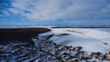 aerial view of the village in the winter clipart