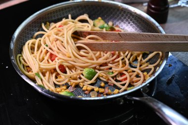 cooking pasta in the pan
