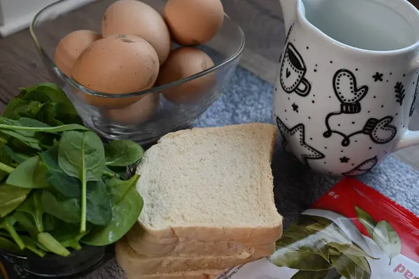 breakfast with egg, bread and vegetables