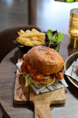 delicious hamburger with cheese and tomato sauce