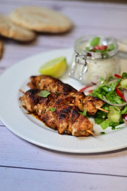 grilled chicken kebab and salad