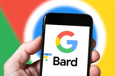 Bard AI Goggle Chrome chatbot extension, artificial intelligence tool. Man with smartphone using Bard Ai website. mobile screen with Bard AI