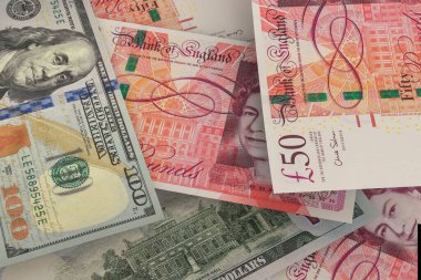 İngiliz sterlini ve Amerikan doları banknotları. Nakit. Mali konsept.