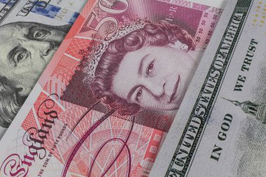 İngiliz sterlini ve Amerikan doları banknotları. Nakit. Mali konsept.