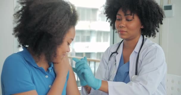 African American Children Getting Vaccine Clinic Hospital Hand Nurse Injecting — Stock Video