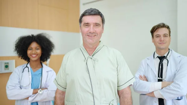 Smiling Patient Receiving Medical Looking Camera Group Medical Diversity Team — Stock Photo, Image