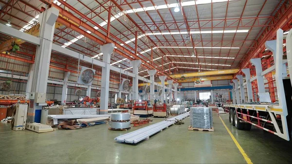 Large industrial buildings or factory with steel structures. Large industrial hall. Warehouse for storage and distribution products of metal sheet roof plant
