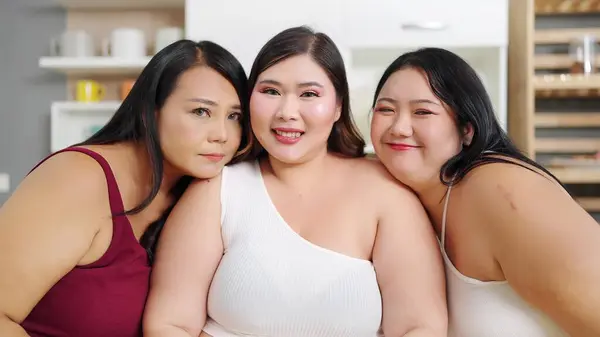Portrait of cheerful Asian plus size women smiling to camera. Happy three chubby women friends. Group of beautiful plus size woman. Body acceptance, body positive concept