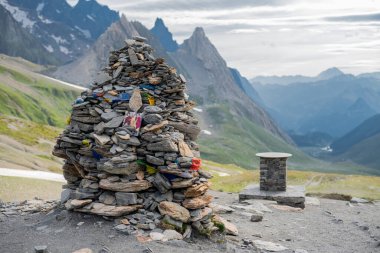 A cairn is a human-made pile (or stack) of stones raised for a purpose, usually as a marker or as a burial mound. clipart