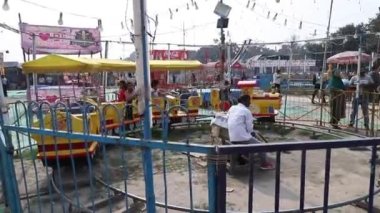 Stock video of kids enjoying train ride at Dussehra mela Ramlila Maidan, New Delhi.