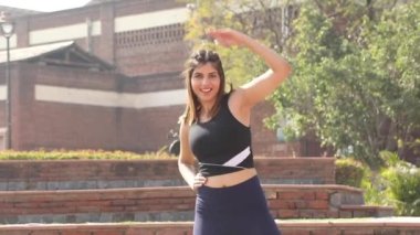 Video of fit girl in gym outfit doing cardio aerobic full body weight loss exercise.