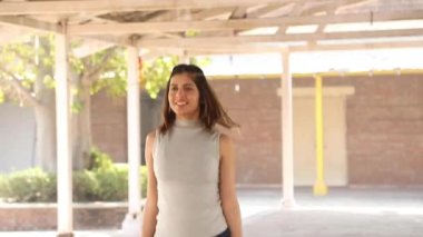 Video of Indian fit woman doing fat burning jumping jack aerobic weight loss exercise.