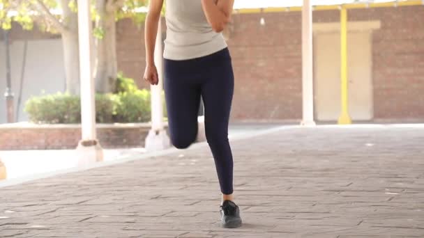 Video Footage Woman Doing Butt Kicks Aerobic Cardio Exercise — Wideo stockowe