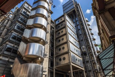 The Lloyds Building in London features a futuristic design with exposed steel and glass elements clipart