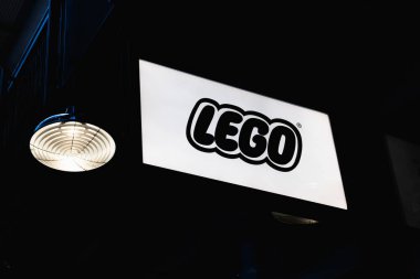 Elegant Lego storefront logo displayed against a sleek black background, symbolizing luxury and sophistication. London, UK, 4 July 2023 clipart