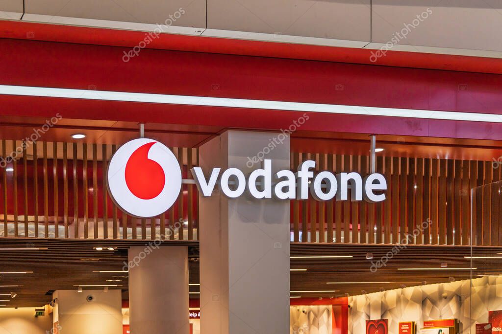 Vodafone store front with red and white branding, captured in a UK retail mall. London, UK, 10 February 2024