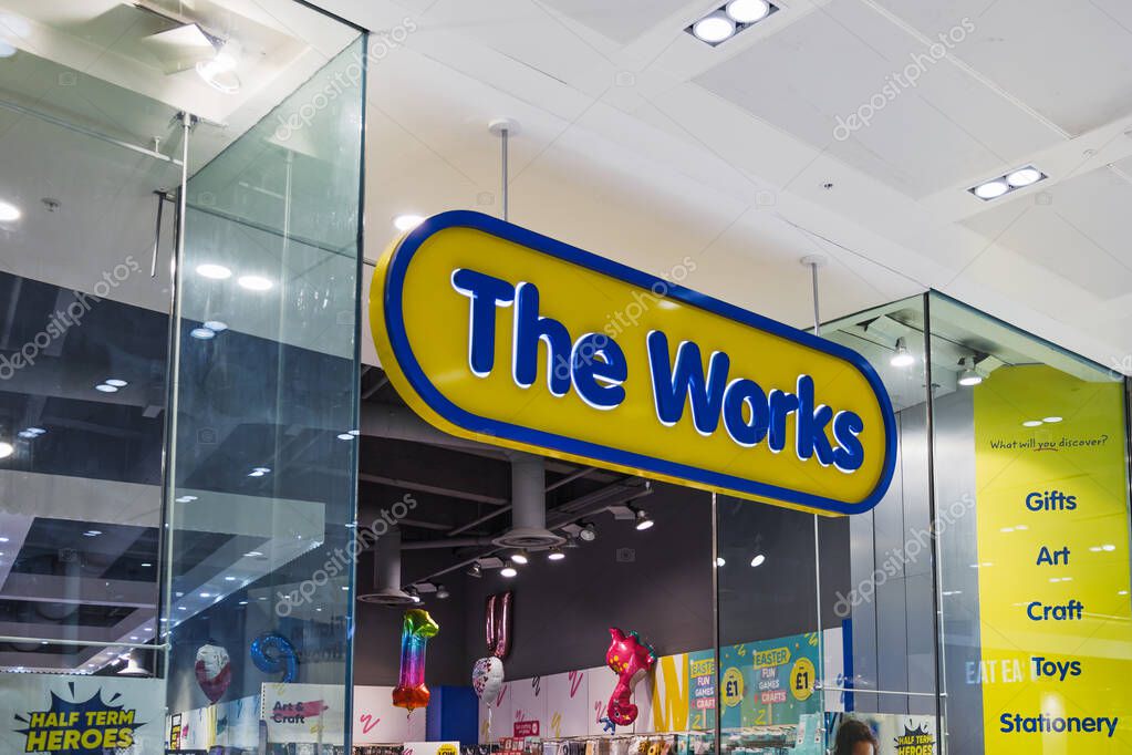 The Works retail store entrance with bright signage in a UK shopping mall, offering books, toys, and gifts. London, UK, 10 February 2024