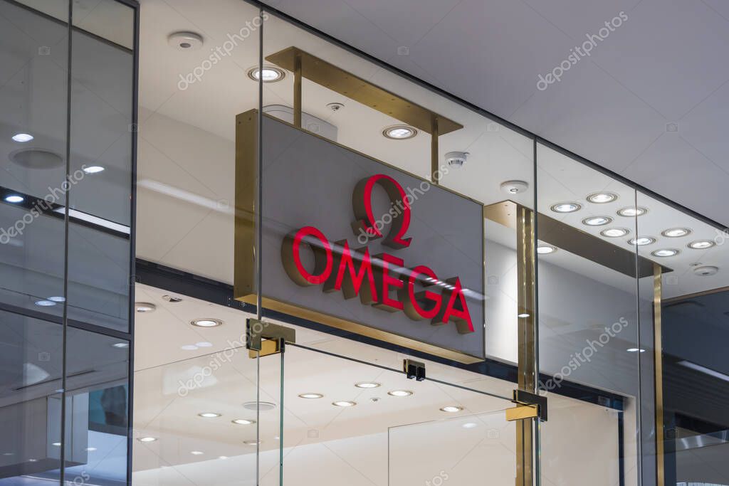 Stylish storefront of Omega, a renowned Swiss watchmaker, displayed in a premium retail environment. London, UK, 10 February 2024