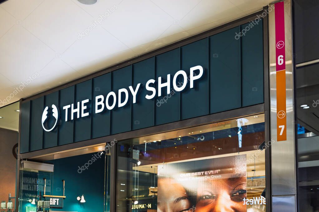 The Body Shop storefront with illuminated sign and eco conscious branding in a stylish shopping mall. London, UK, 10 February 2024