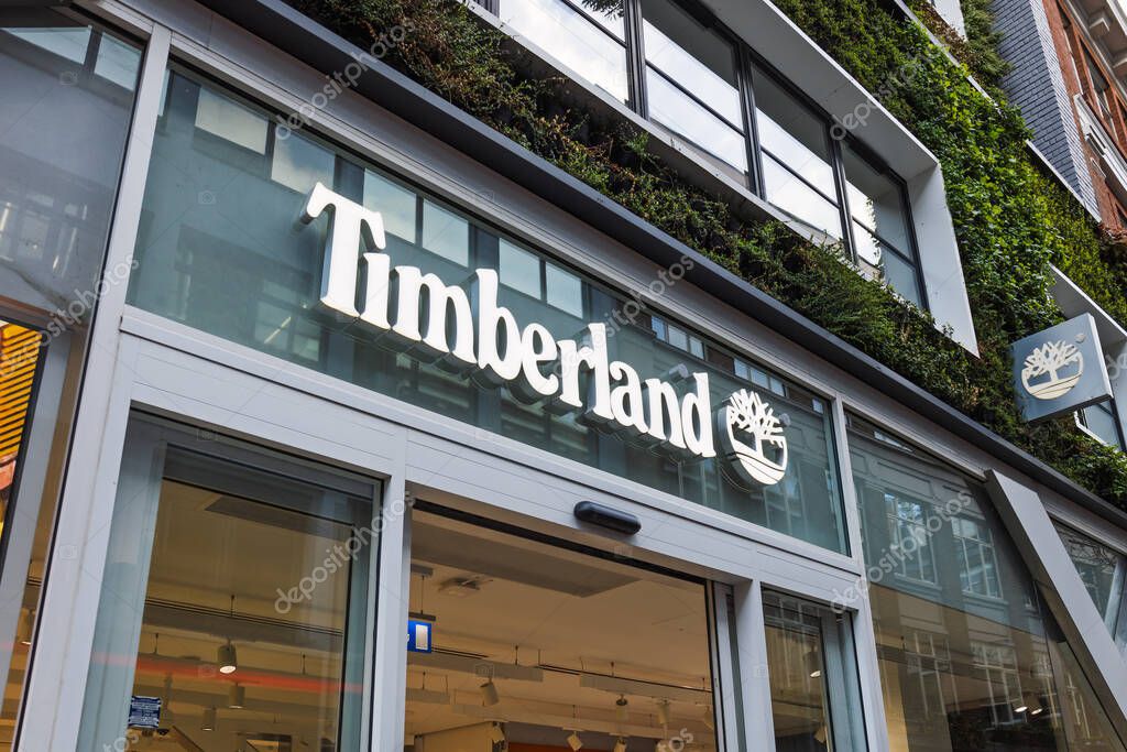 Urban storefront featuring Timberland branding on modern retail shop in busy shopping district. London, UK, 3 March 2024