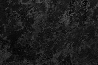 İnce damarlı ve desenli yüzeyi olan siyah mermer taşın ayrıntıları..