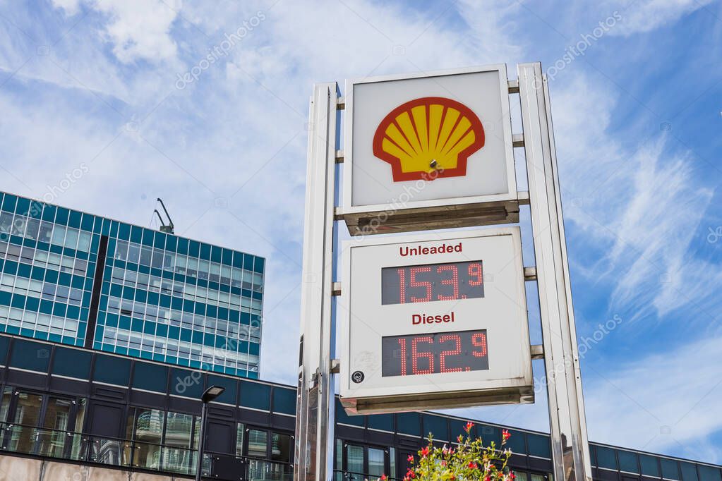 Shell gas station price board in city, displaying fuel costs and the recognizable Shell logo. London, UK, 14 April 2024