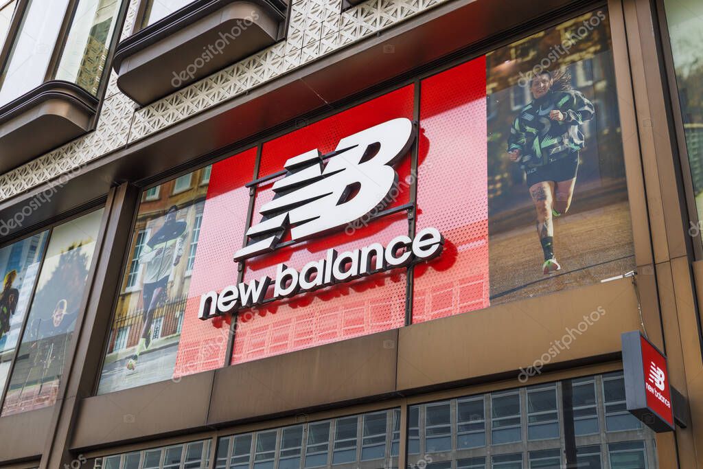 New Balance store in London with bold logo, athletic footwear and sportswear brand storefront exterior. London, UK, 14 April 2024