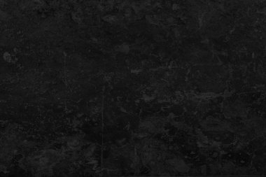 Koyu siyah grunge yüzeyine yakın, ince taş ve kayrak dokularla..